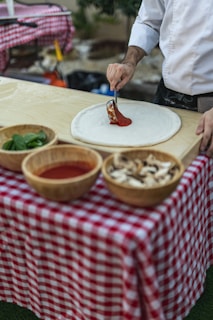 a man is preparing food on a table