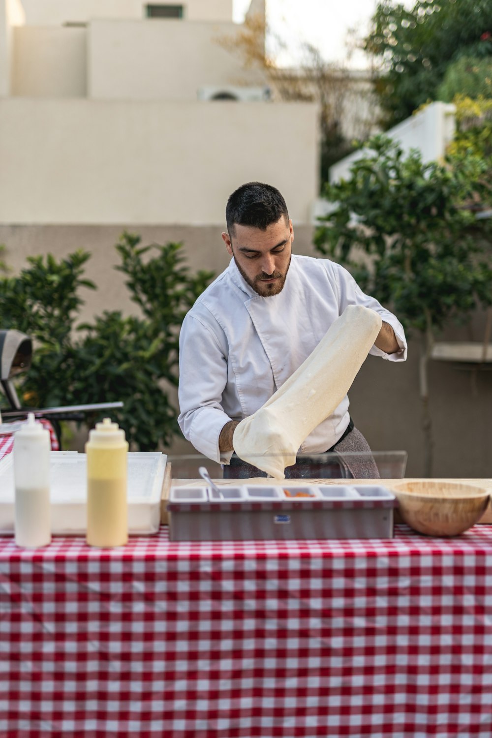 a man preparing food on top of a table