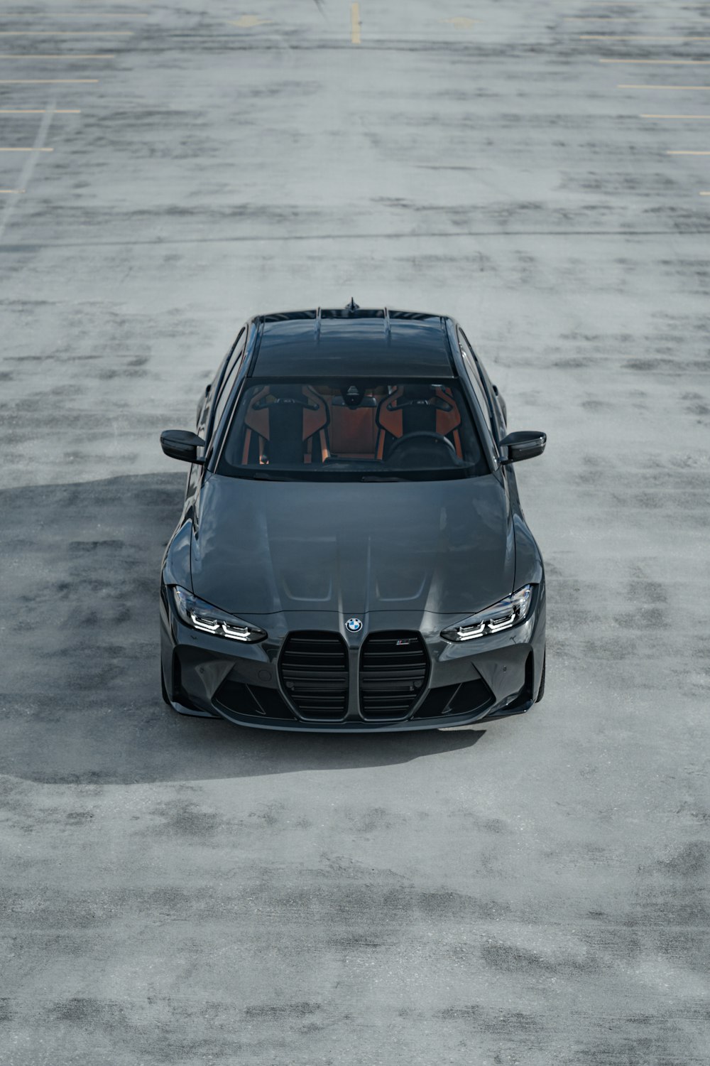 a grey car parked in a parking lot