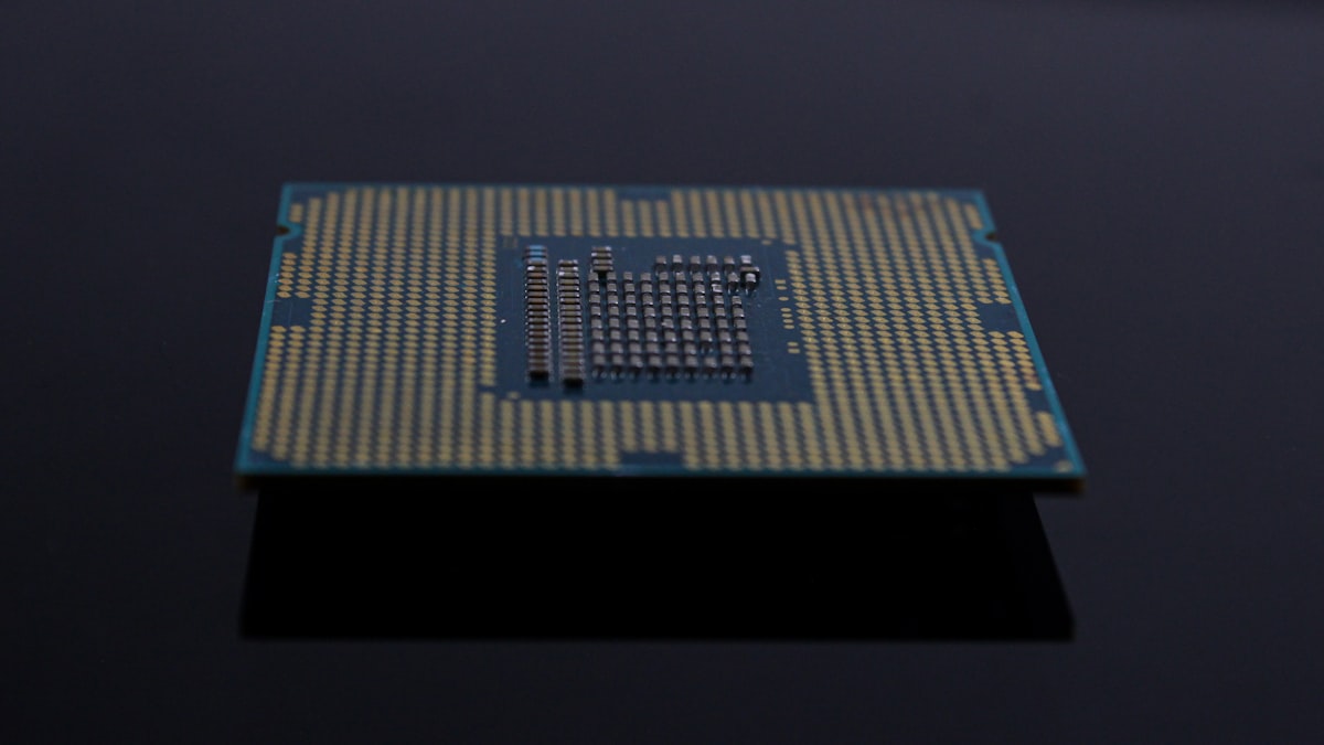 Close-up of a computer processor chip showing intricate circuit traces and contact points