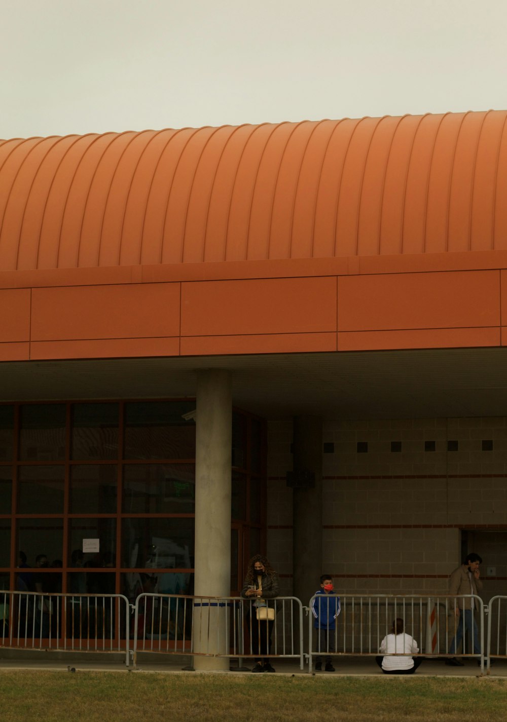 a group of people standing outside of a building