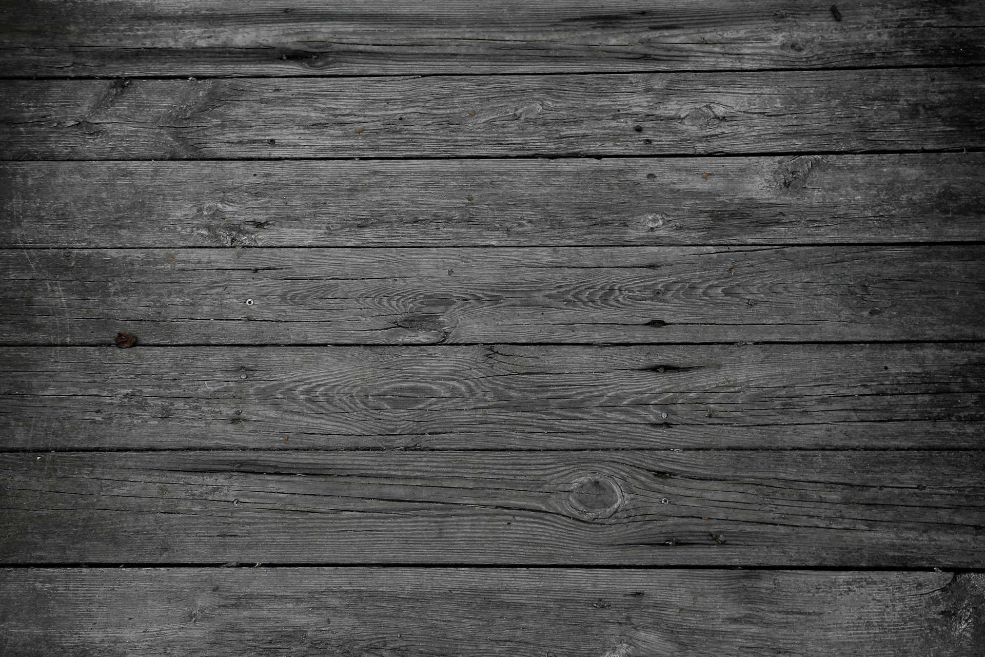 a black and white photo of wood planks