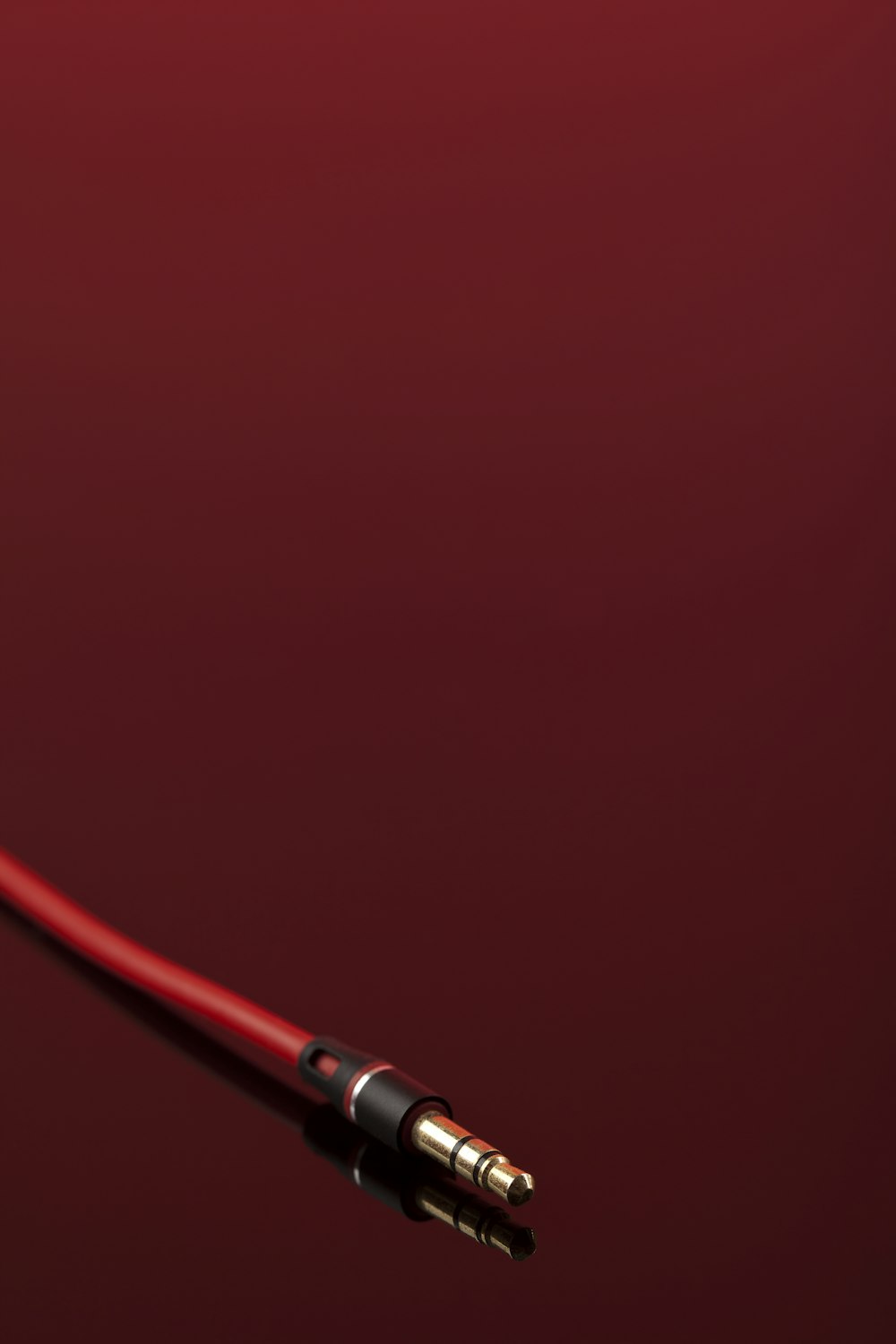 a close up of a red and black cable