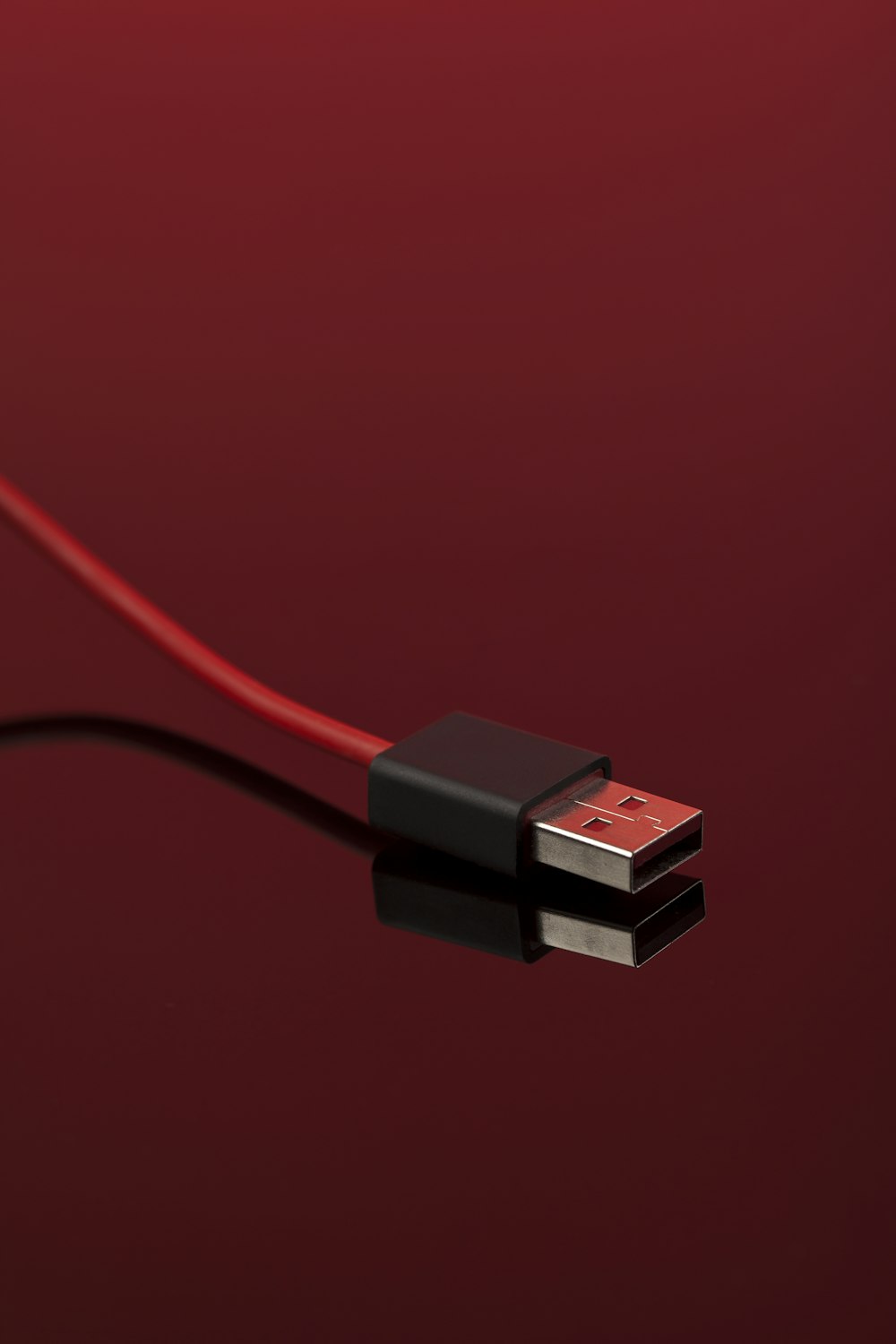 a close up of a red and black cable