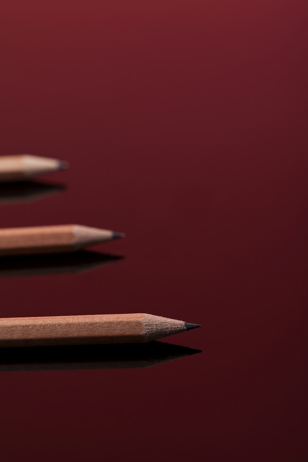 a row of pencils sitting on top of a table