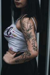 a woman with a tattoo on her arm