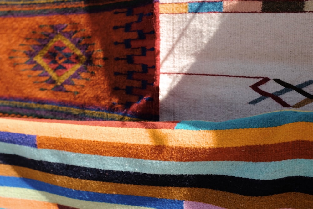 a close up of a multi colored blanket