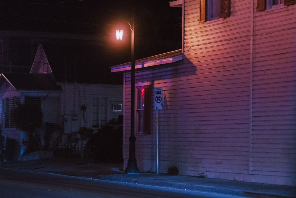 a street light on a pole next to a house