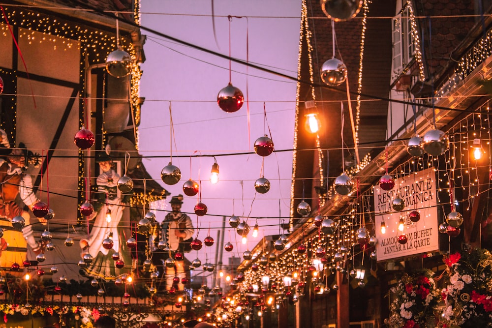 a street filled with lots of lights and decorations