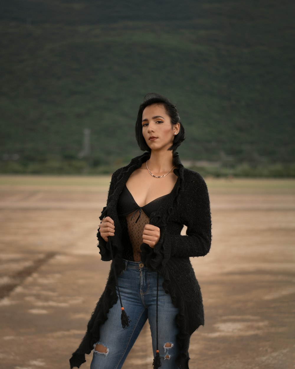 a woman is standing in a parking lot