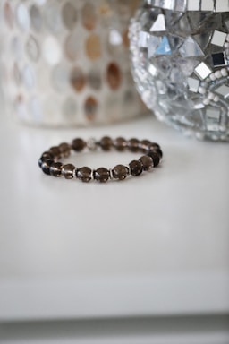 a close up of a bracelet on a table