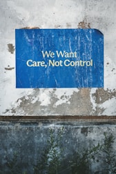 a blue sign that says we want care, not control