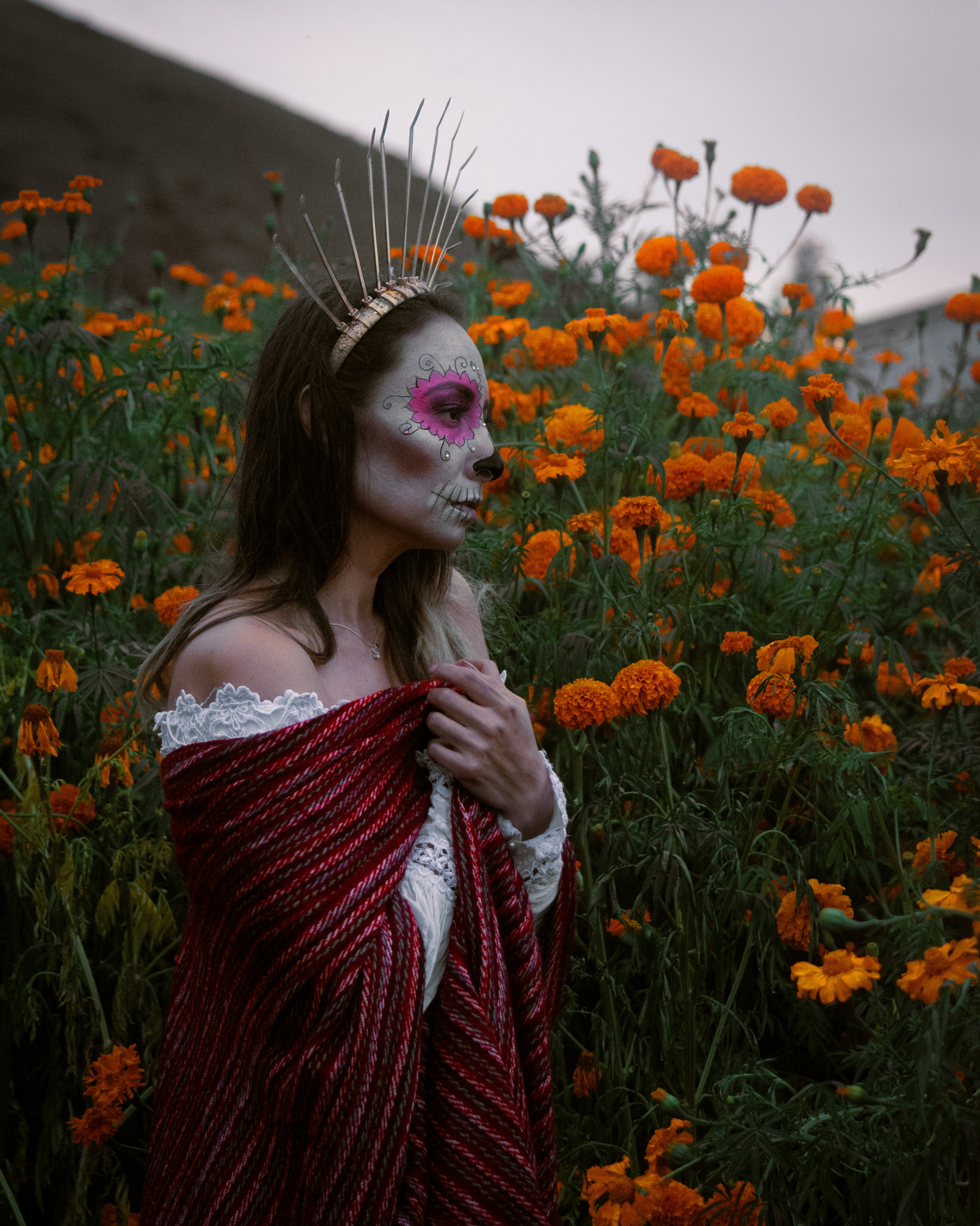 a woman in a field of orange flowers