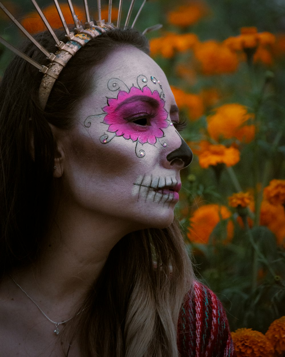 a woman with a flower painted on her face