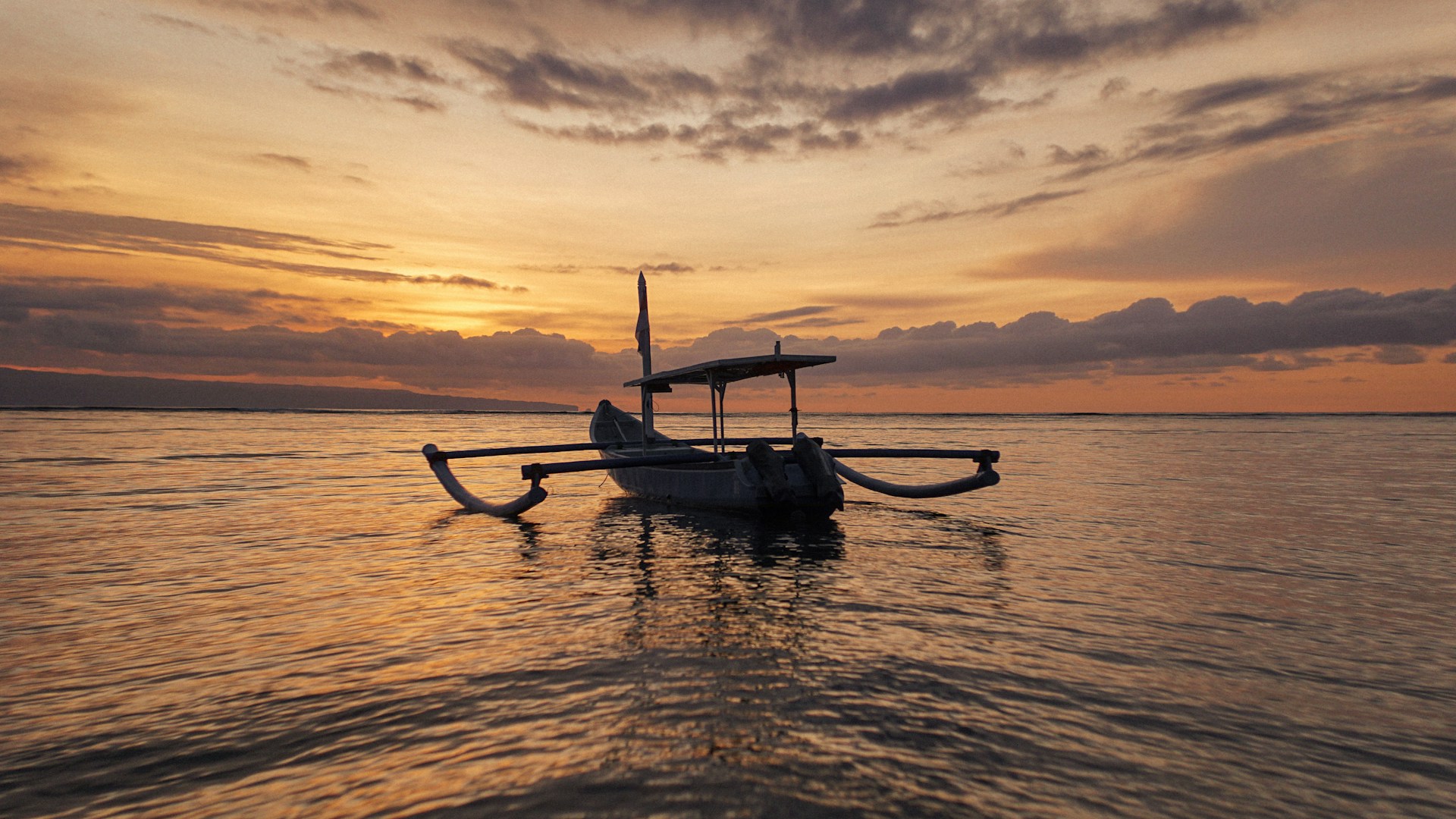 a boat floating on top of a large body of water