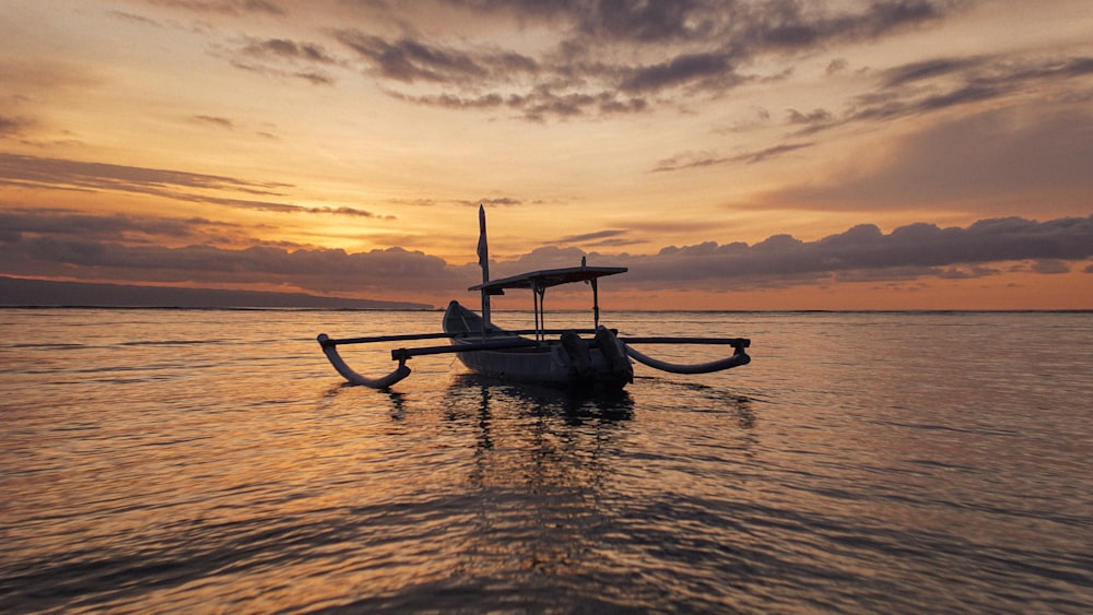 a boat floating on top of a large body of water