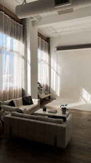 A bright, professionally staged living room captured with natural light highlighting the spacious layout.