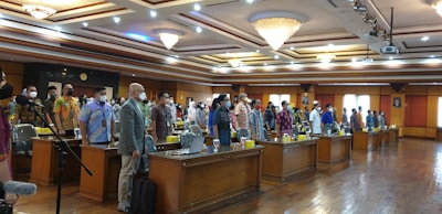 A lively pre-moot event with participants debating in a formal setting.