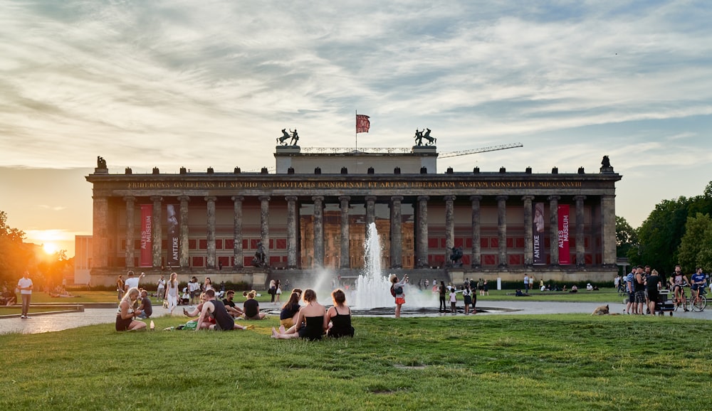 a group of people standing in front of Altes Museum