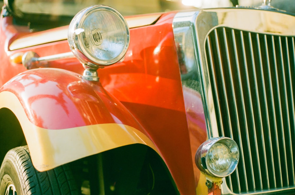 a close up of a red and yellow car