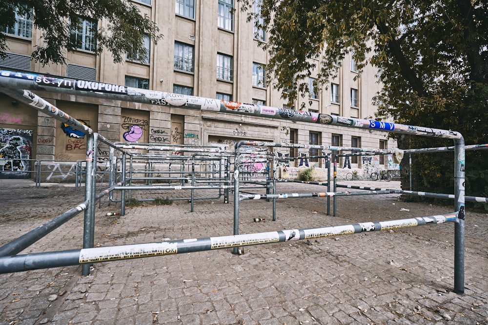 a row of metal barricades in front of a building