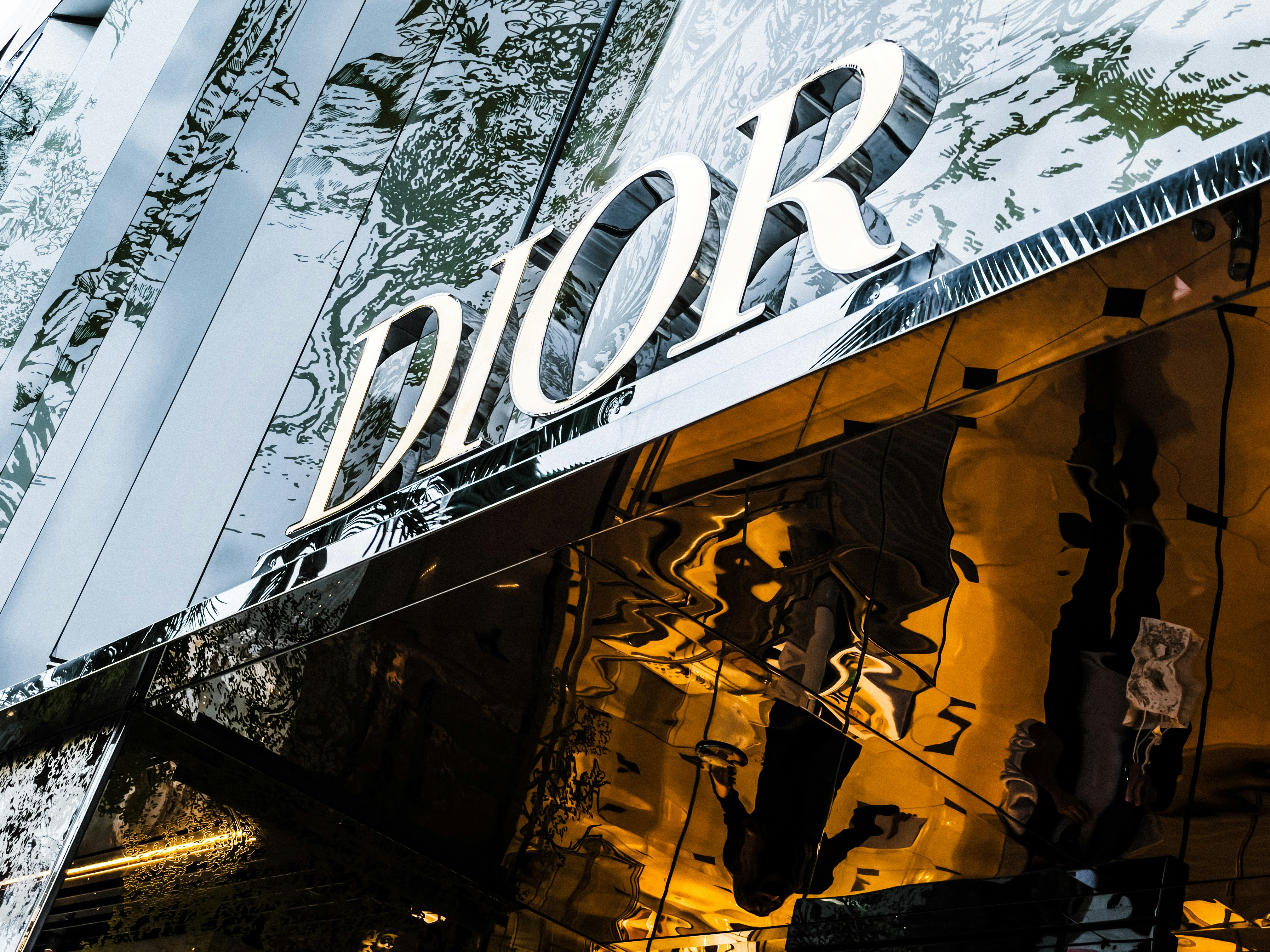 a reflection of a building in the windows of another building