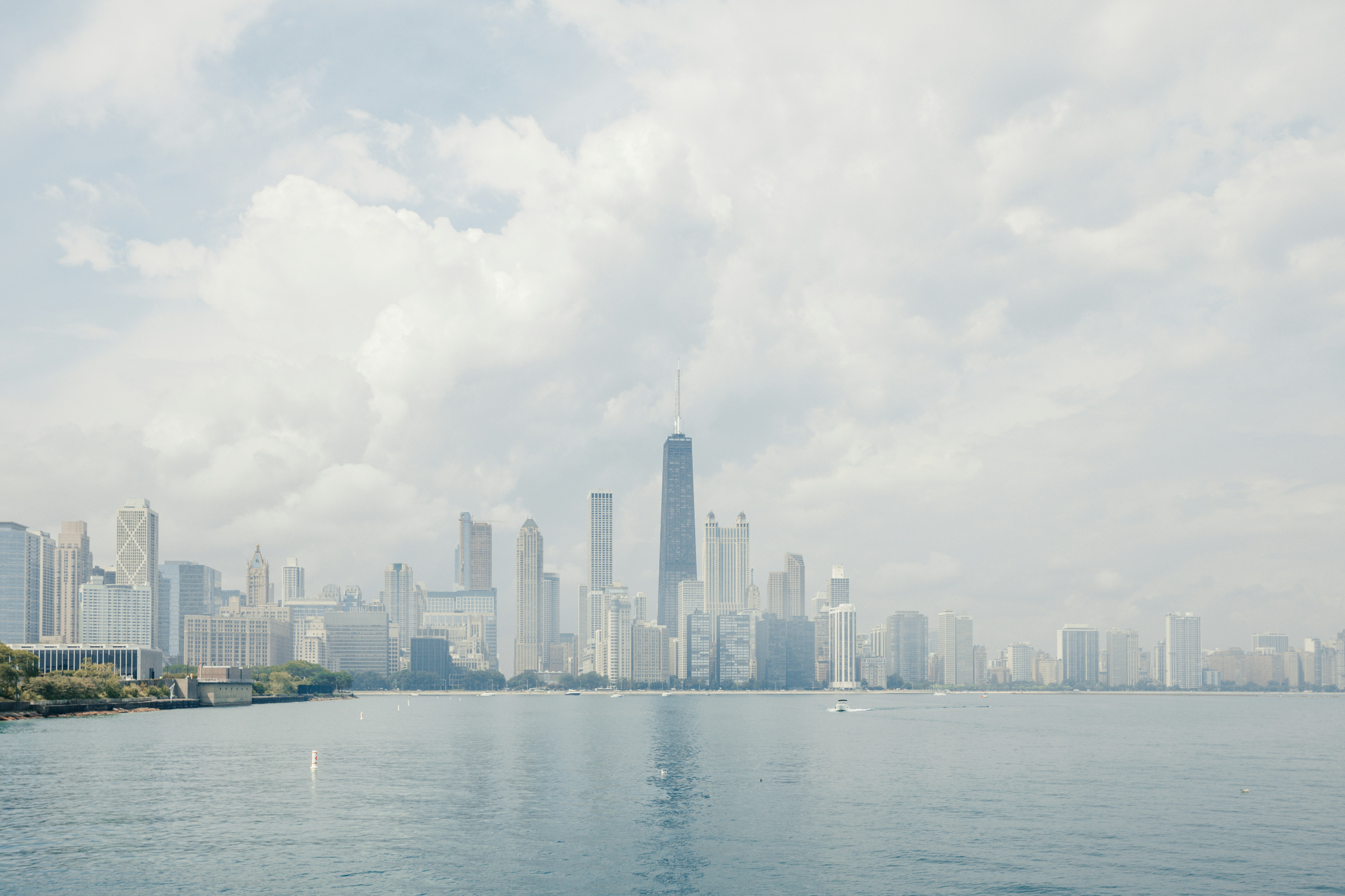 a large body of water with a city in the background