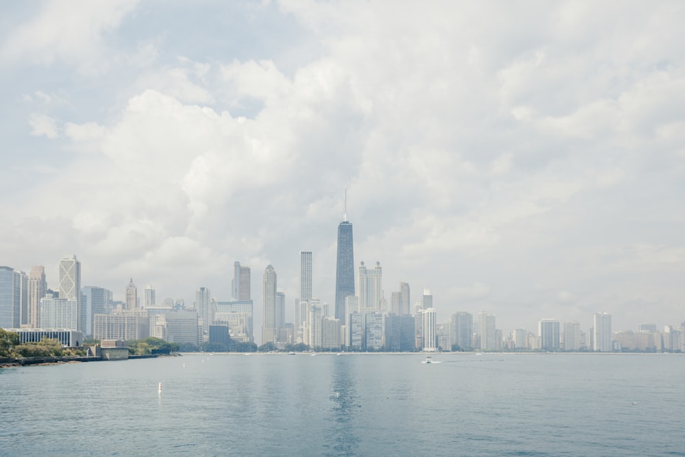 a large body of water with a city in the background