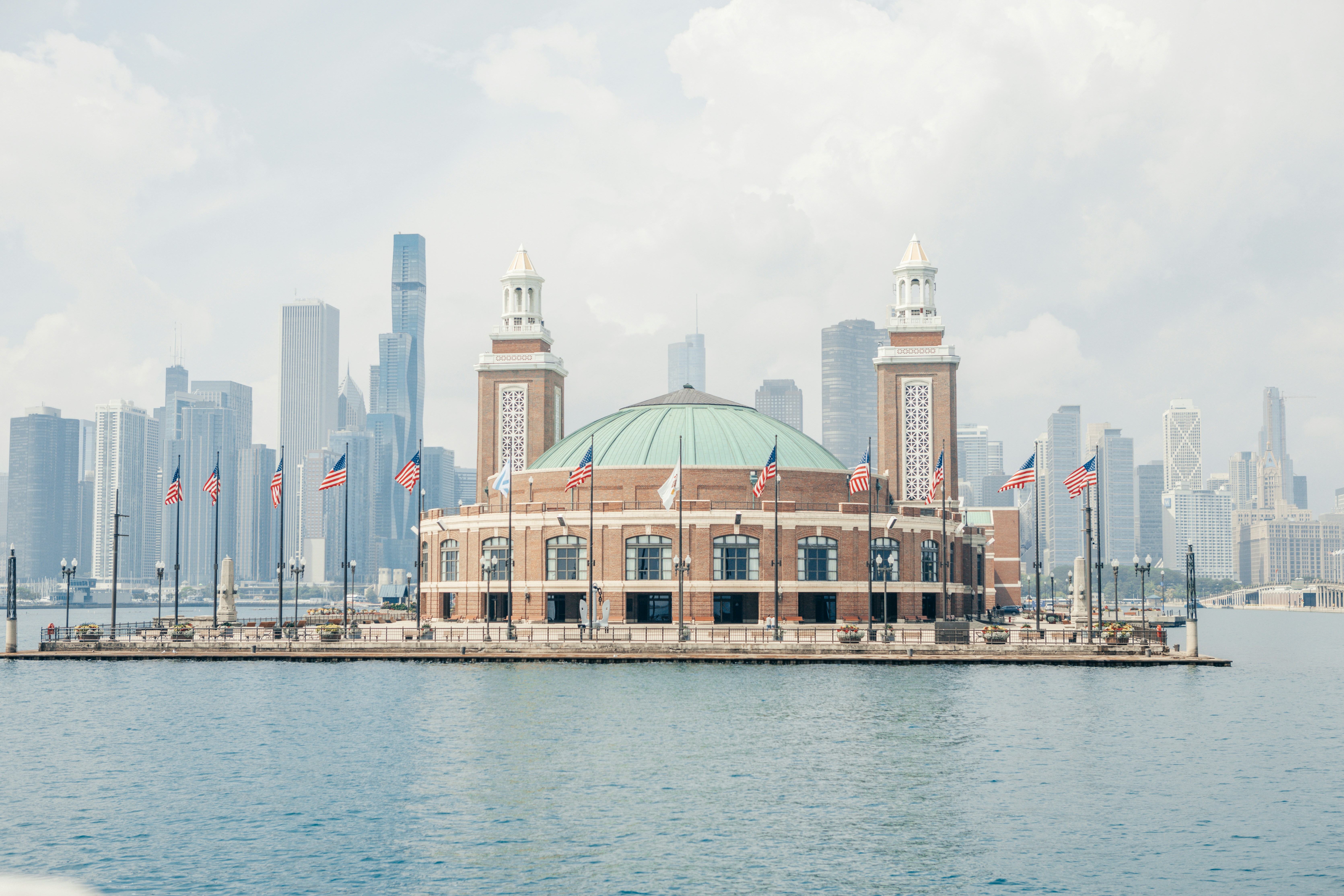 a-large-building-sitting-on-top-of-a-body-of-water-photo-free-summer