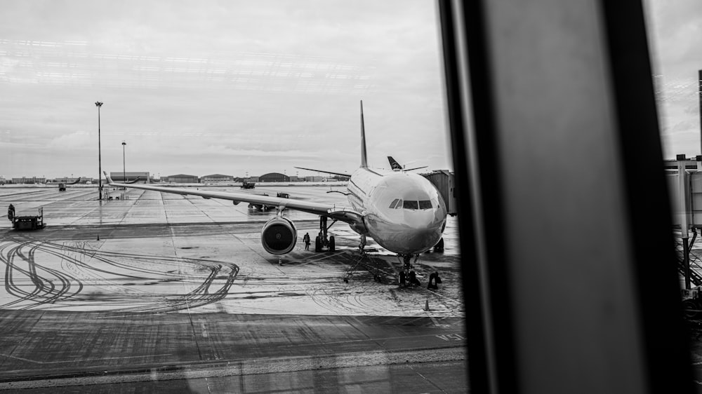 a large jetliner sitting on top of an airport tarmac