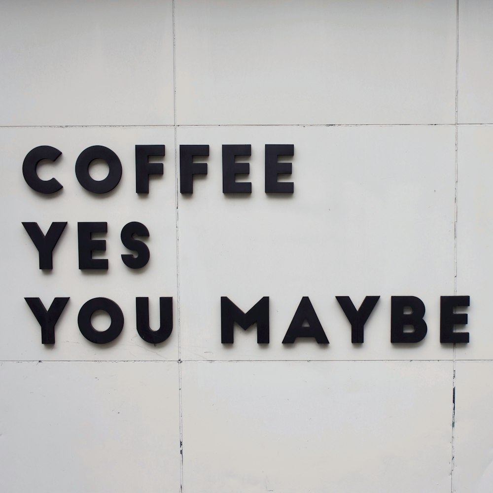 a sign that says coffee yes you maybe