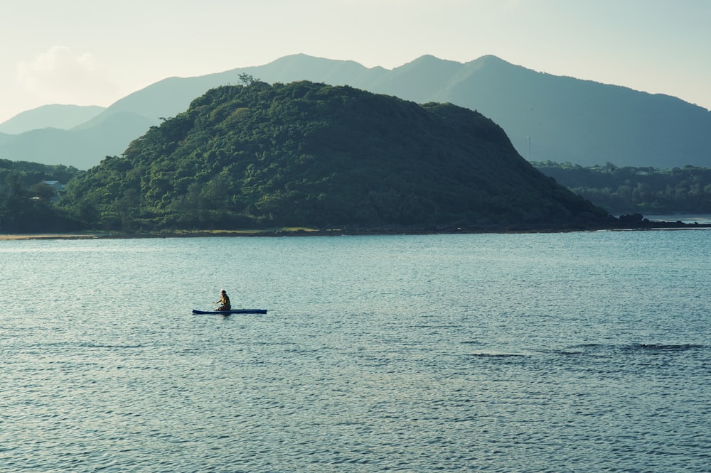 a person in a boat on a large body of water