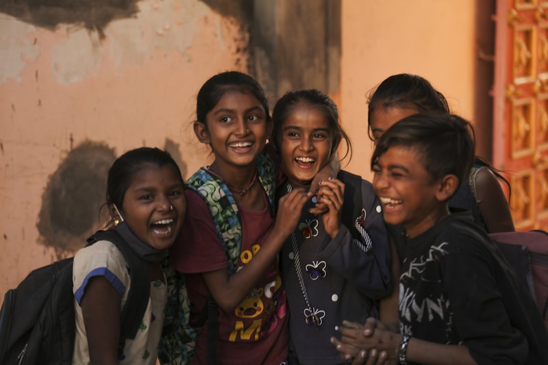 a group of young girls standing next to each other