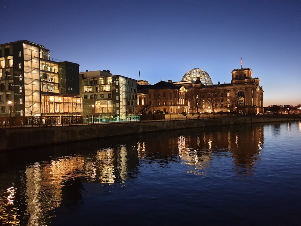 a large building next to a body of water