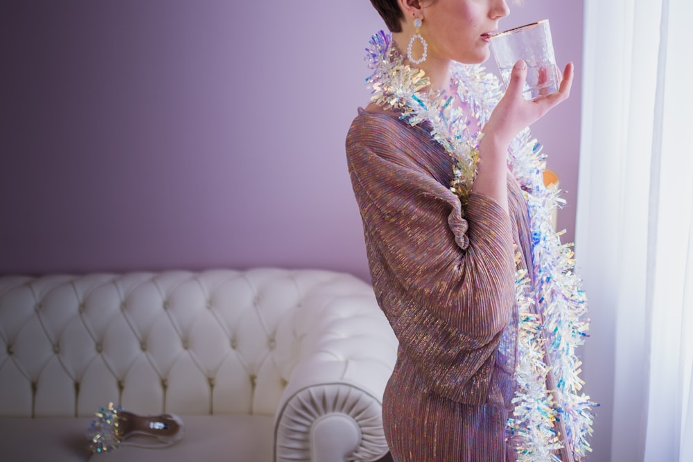 a woman in a dress smoking a cigarette