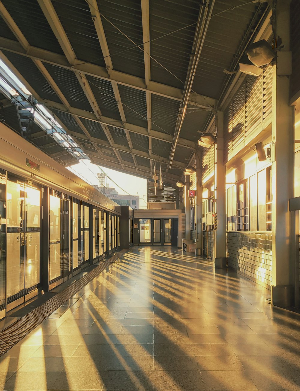 a long hallway with a lot of glass doors