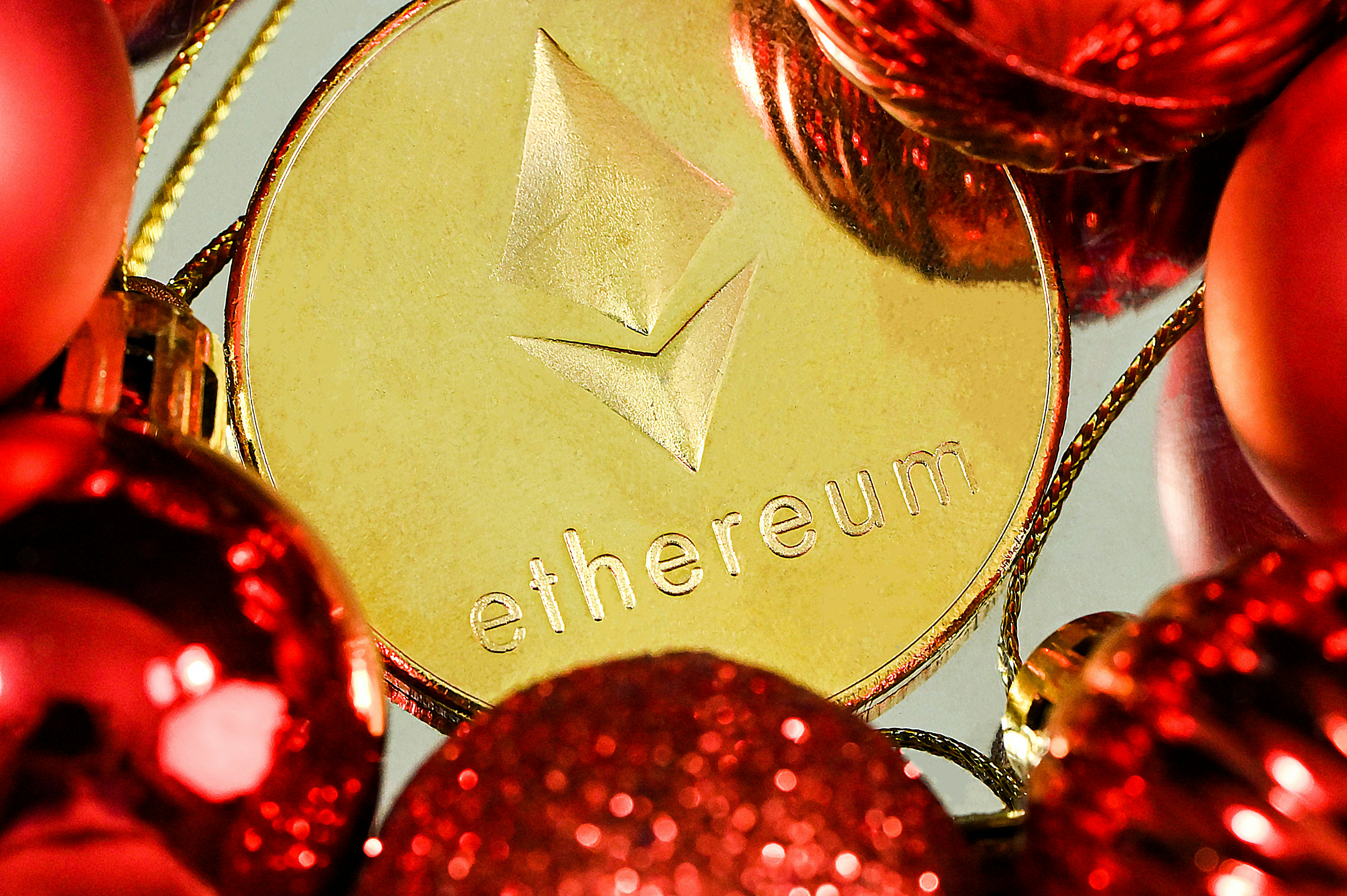 An Ethereum coin surrounded by the red balls
