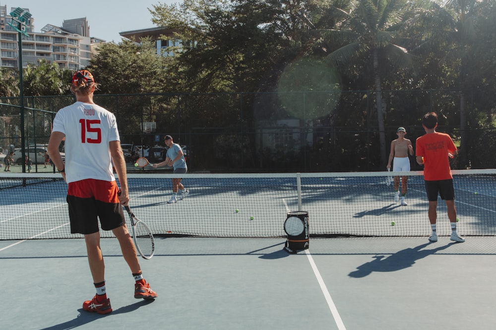 a man standing on a tennis court holding a racquet