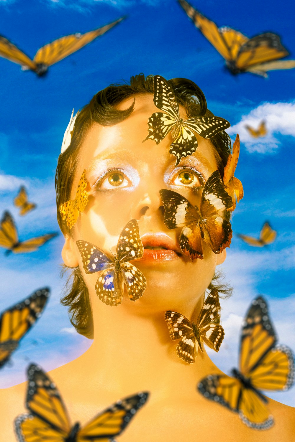a woman with butterflies painted on her face