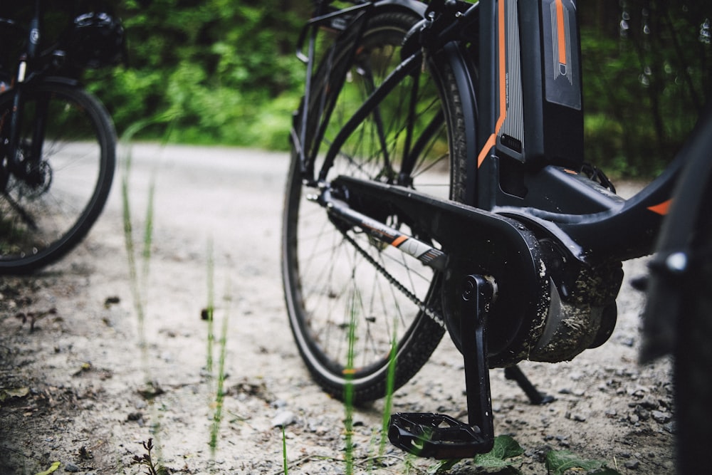 a close up of a bike on a dirt road