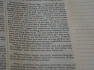 Close-up of a smart textbook page with QR codes linking to 3D animated videos.