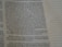 A close-up view of an open book page with printed text in English. The focus is on a particular section of text on the left, while the right side displays blank lines for note-taking.