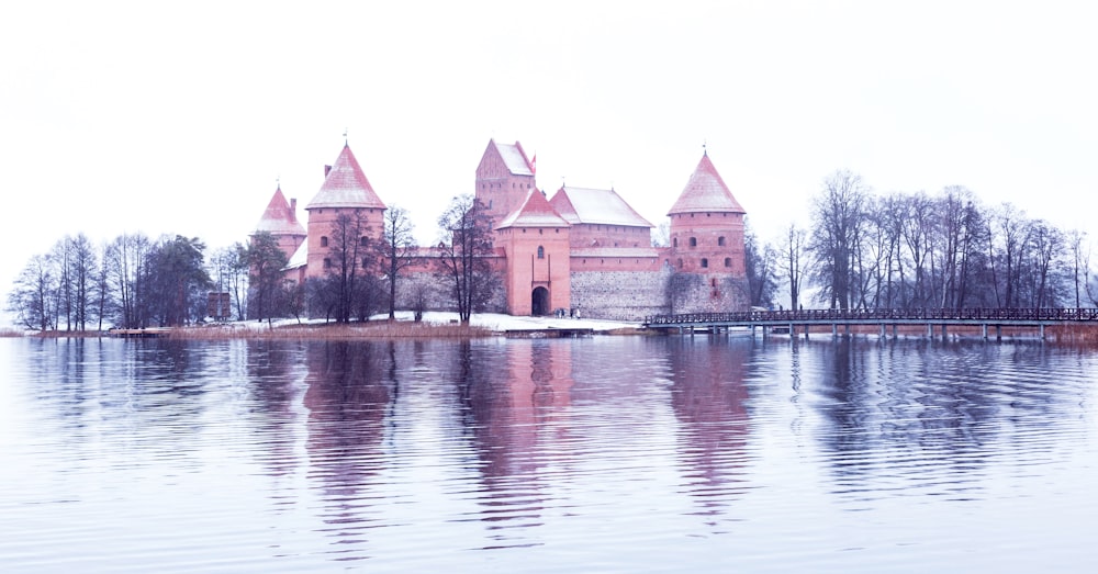 a large castle sitting on top of a lake