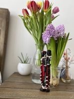 Finished plaster decorations displayed on a wooden table.