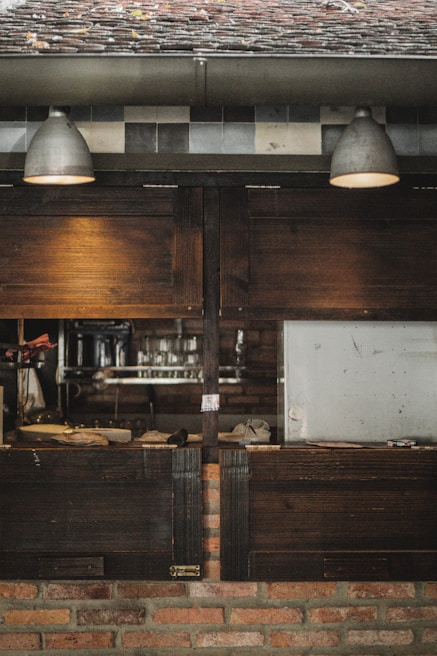 A cozy kitchen with rustic wooden elements and warm lighting.