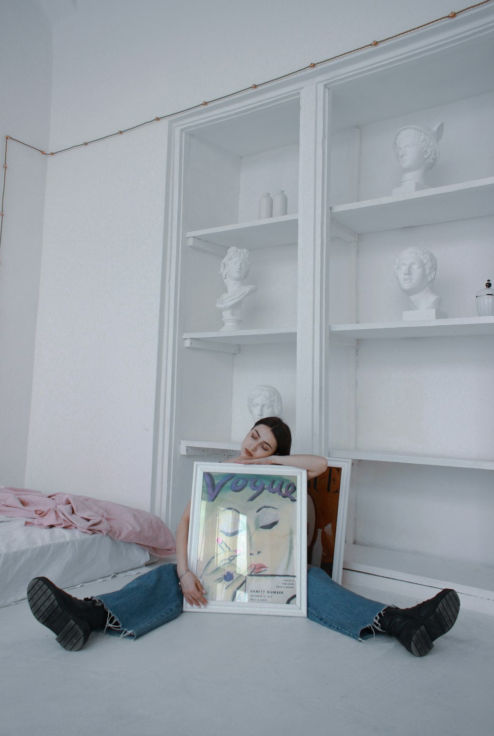 a person lying on a bed in a room
