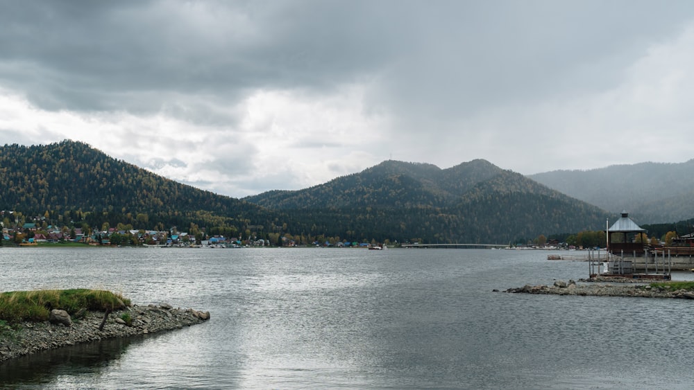 a body of water with mountains in the background