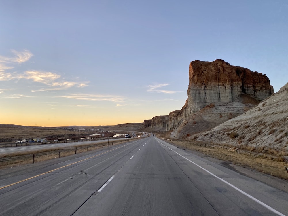 a highway with a mountain in the background