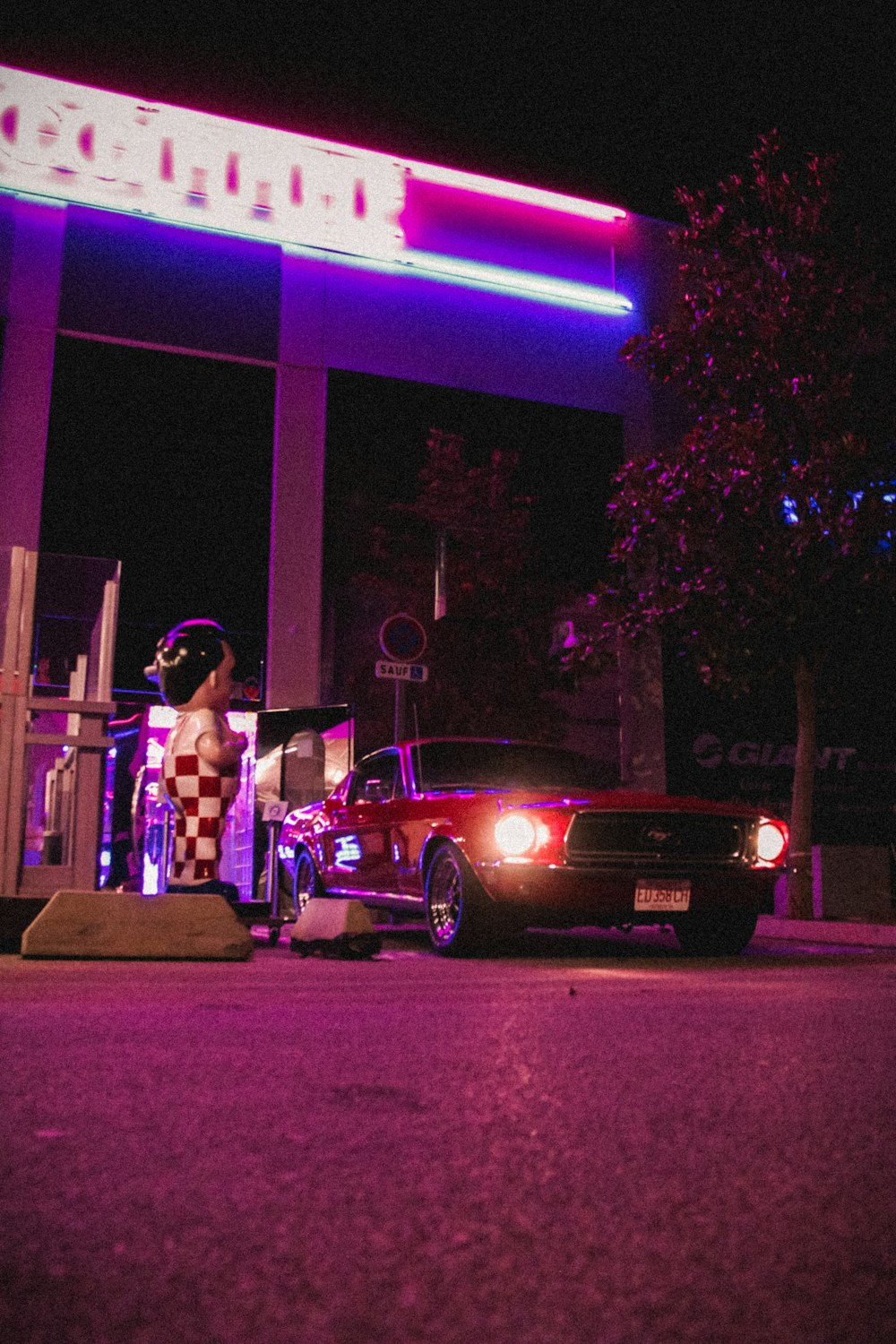 a car parked in front of a gas station