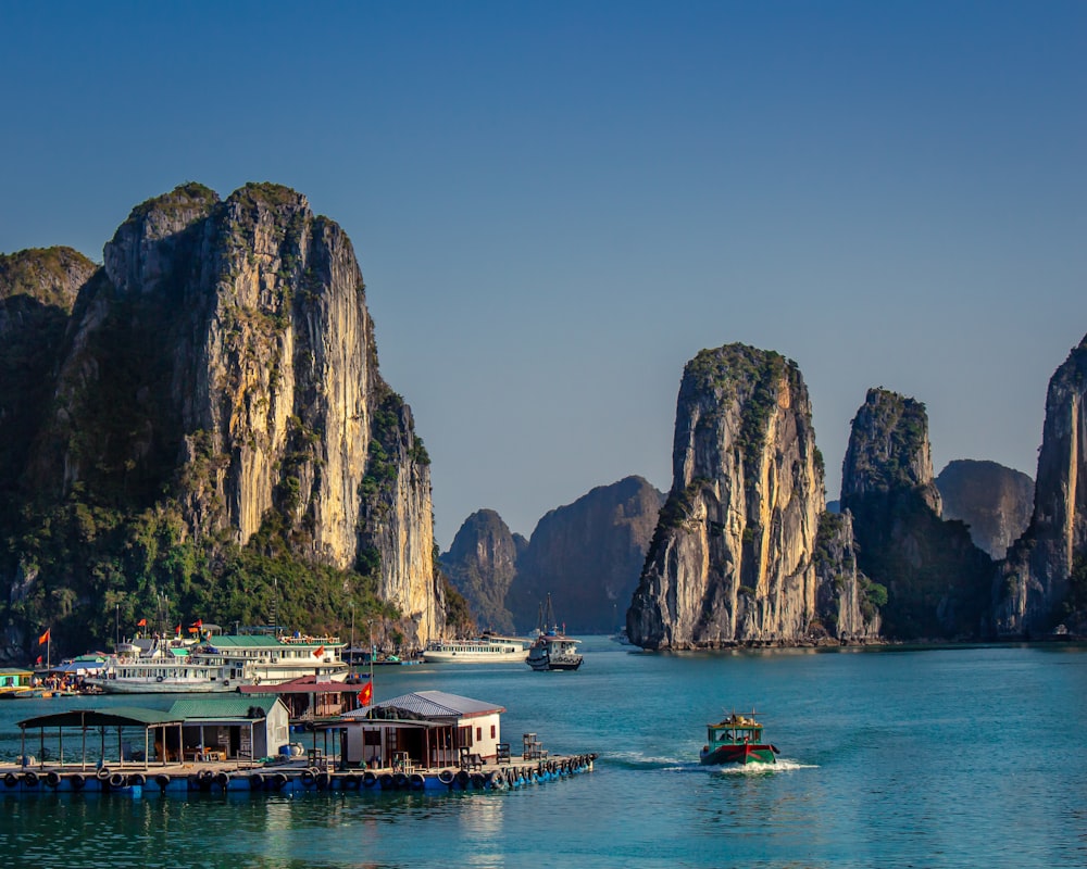 a group of boats floating on top of a body of water